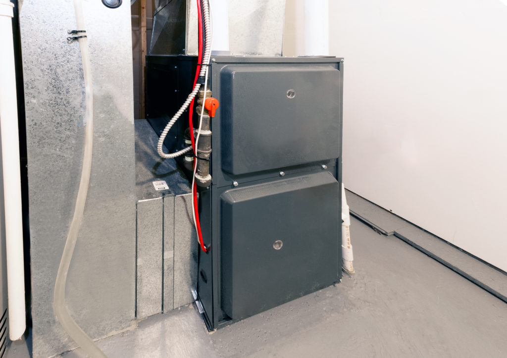 Furnace in the basement of a house.
